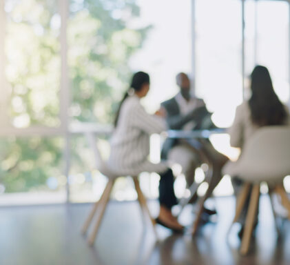 Business meeting, blurred background and people in office for teamwork, collaboration and planning, Partnership, negotiation and group in solidarity for growth, consulting and corporate solution