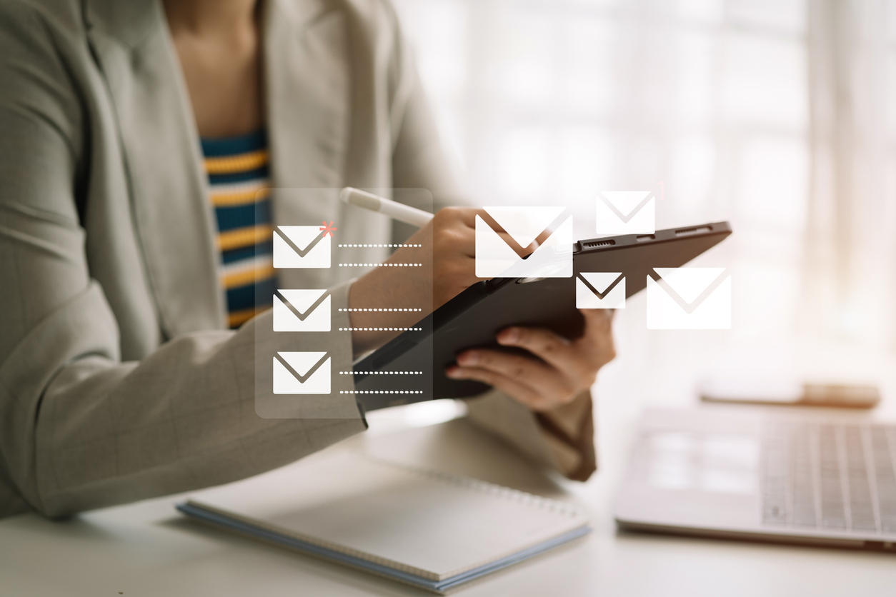 Email notification concept, women use tablet and laptop receive message alert in the mailbox.