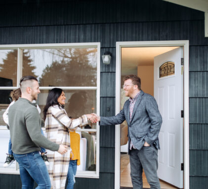 Real Estate Agent Meeting Prospective Buyers