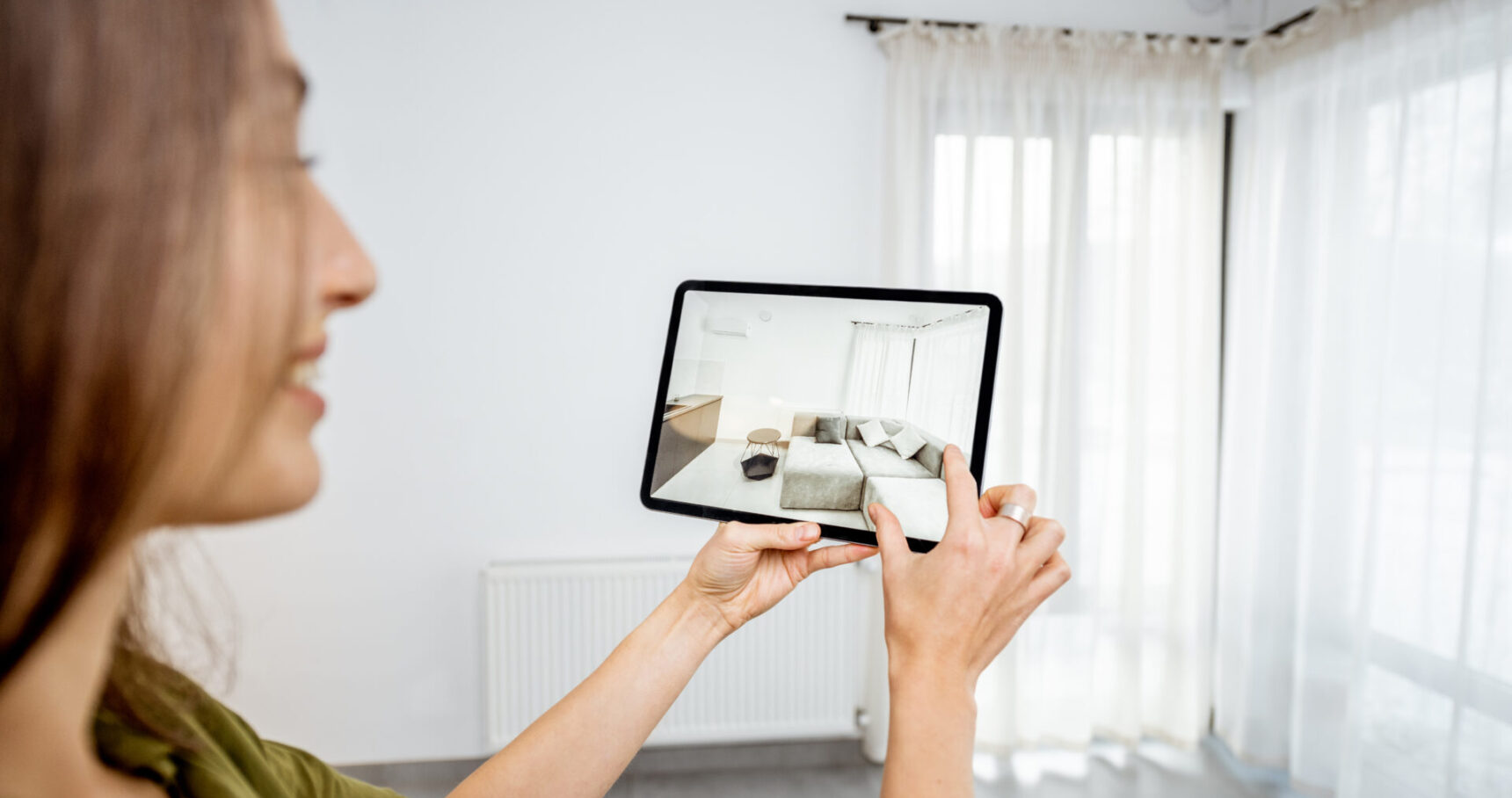Woman using augmented reality to design interior