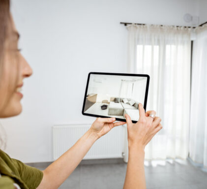 Woman using augmented reality to design interior