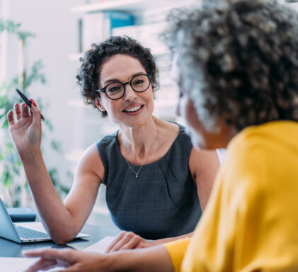 Colleagues discussing project at workplace.