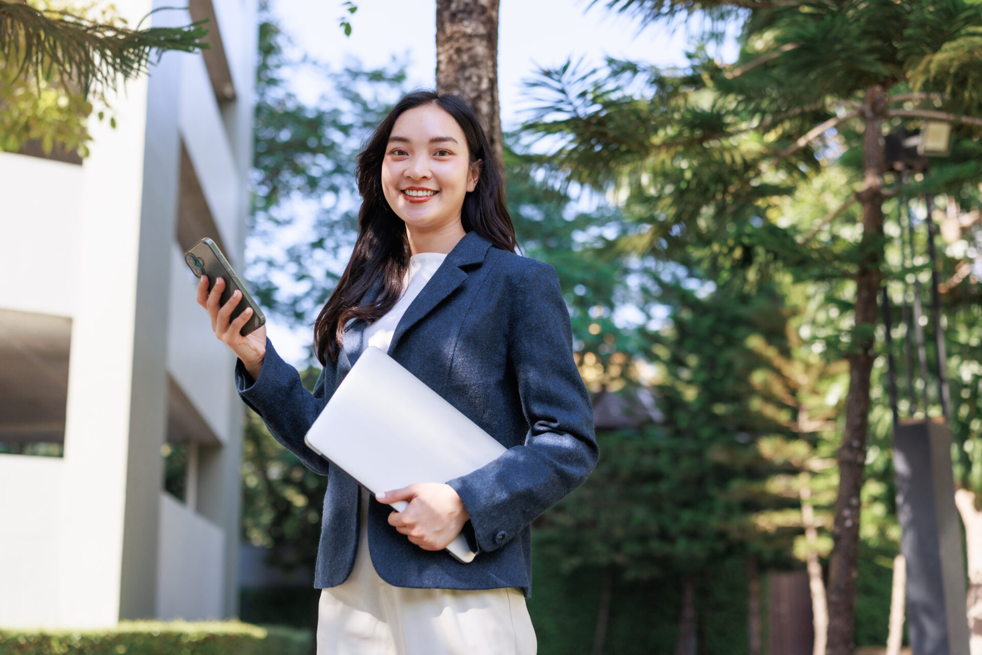 young businesswoman smiling while using phone and 2026 03 05 11 43 52 utc