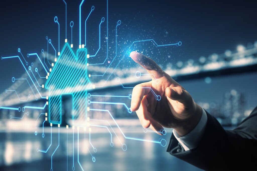 Close Up Of Businessman Hand Pointing At Abstract Glowing House Chip Hologram